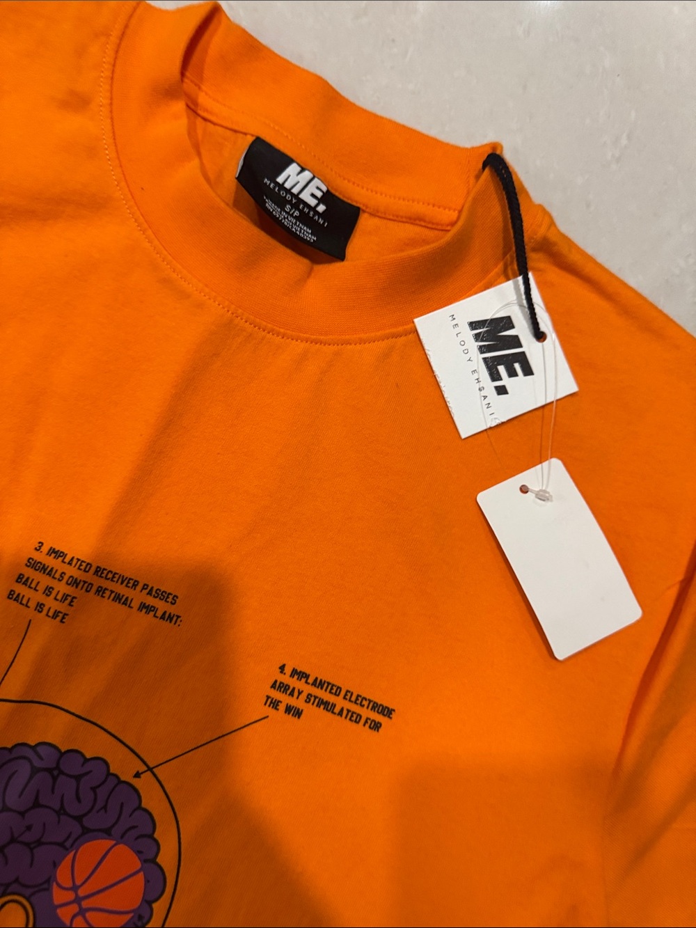 ME Makeover Essentials Orange 'Ball Vision' Graphic Tee - Picture 3 of 3